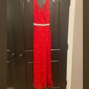 Selling a red sparkly prom dress.